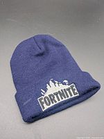 Front view of navy Fortnite beanie showing embroidered logo