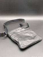 Front view of black leather Coach shoulder bag with strap