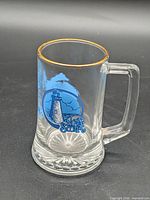 Full view of glass stein showing gold rim and Nova Scotia graphic
