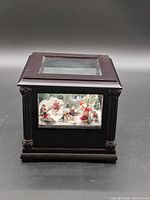 Closed display box front view showing glass panel with winter scene inside