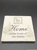 Front view of plaque showing design and quote