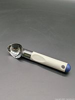 Full view of scoop on dark surface