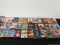 Wide shot of all VHS tapes laid out on table
