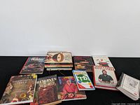 Full lot overview showing all cookbooks spread on black surface