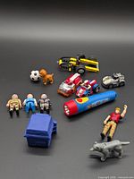 Overview of entire toy lot spread on surface