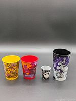Group shot of four cartoon tumblers