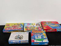 Overview of six boxed items: Operation, Game of Life, two Rebound, Solar Robot kit, Connect 4 Launchers