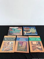 All five books front covers visible