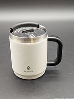 Full view of Manna white insulated travel mug with handle