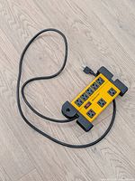 Top view of yellow 8-outlet Mastercraft power bar with cord