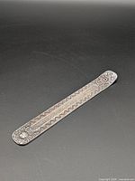 Full view of stamped metal incense holder