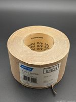 Full view of Norton Adalox sandpaper roll showing width and packaging label