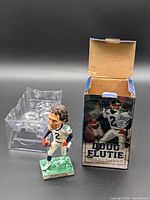 Bobblehead, plastic clamshell, and original box