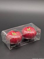 Front view of boxed red tomato salt and pepper shakers