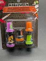 Front of sealed package showing five stampers