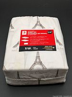 Front of sealed package showing red product label