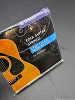 Front of sealed Yamaha folk guitar strings package