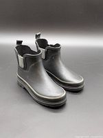Front three-quarter view of both boots
