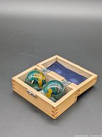 Pair of Baoding balls in open wood box