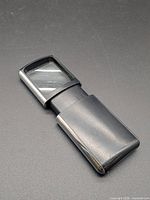Front view of pocket magnifier with lens extended
