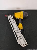 Full view of pneumatic framing nailer showing body and magazine