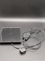 Entire antenna panel with coax cable, inline amplifier and power adapter visible