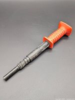 Full view of Remington powder actuated tool showing handle and barrel