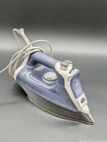 Front angled view showing full iron with cord