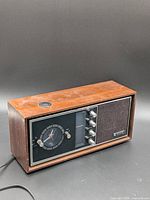 Front view of Sanyo wood cabinet clock radio showing overall design