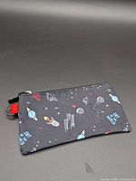 front view showing space print and zipper