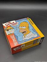 Top view of Photomosaics Homer Simpson 1000-piece puzzle box