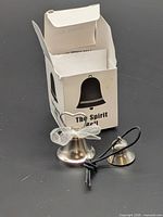 Two metal bells and box front