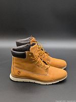 Side view of both Timberland boots showing uppers and laces