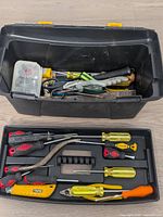 Overview of open toolbox, removable tray and assorted tools