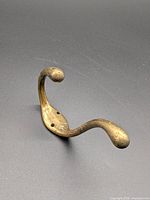 Front view of brass double coat hook