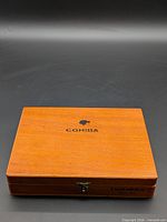 Closed wooden box showing Cohiba logo on lid