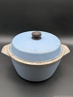 Dutch oven with lid in place, shows exterior color and knob