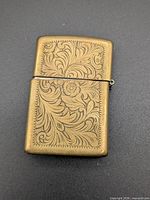 Front view of brass etched Zippo lighter