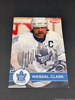 Front of Wendel Clark National Alumni card showing signature