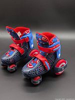 Side view of both skates showing color, straps, wheels