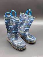 Full view of both shark-print boots standing upright
