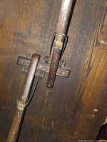 Close-up of spring hinge mechanism on underside of folding table