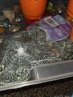 bagged glass stones, partial view of beads and small containers