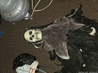 fog machine, grey fog light, hanging skeleton head visible