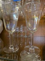 Pair of iridescent wine glasses on shelf
