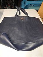 Navy blue woven tote purse with magnetic clasp