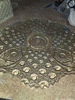 Clear pressed glass underplate with Daisy & Buttons pattern