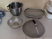 Overview of all four stainless items on tabletop