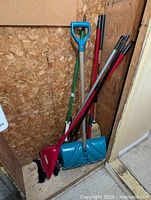 Corner view showing all cleaning tools leaning together