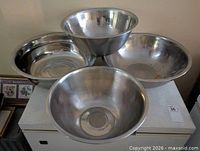 All four stainless steel mixing bowls displayed together